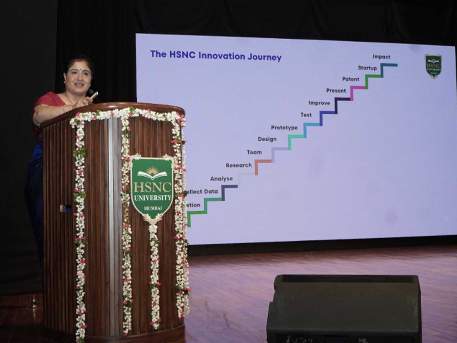 Vice Chancellor Col. Prof. Hemlata K. Bagla addresses the incoming 2026 cohort at HSNC University's Master Induction Series, encouraging lifelong learning and innovation.
