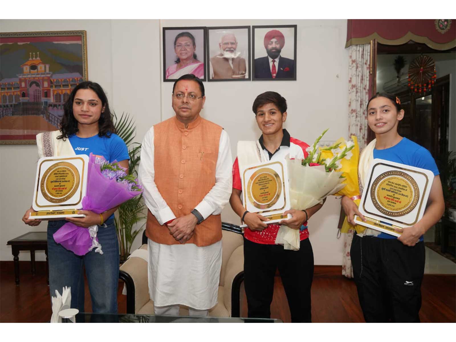 CM Pushkar Singh Dhami felicitates Nikita Chand, Kajal Farswan, Aarti Dhariyal. (Photo/UK CMO)