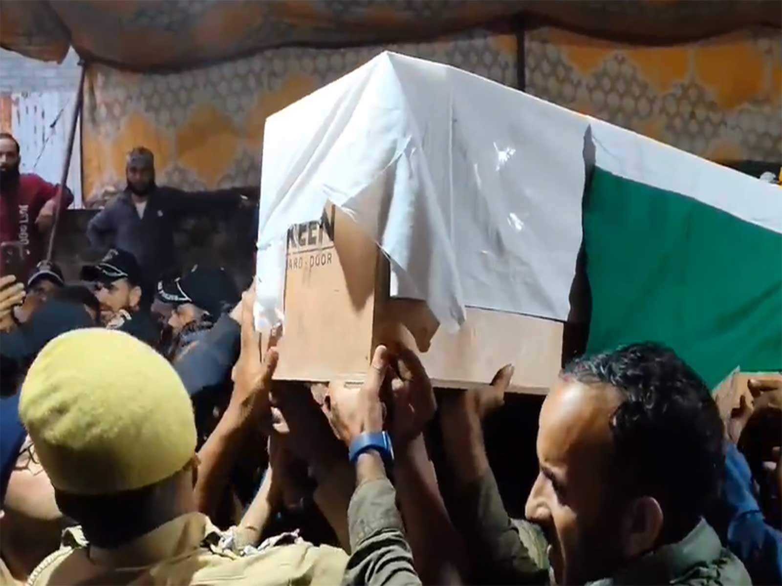 Family members and locals pay their last respects to Head Constable Ashiq Hussain Qureshi at his native village on Wednesday.  (Photo/ANI)