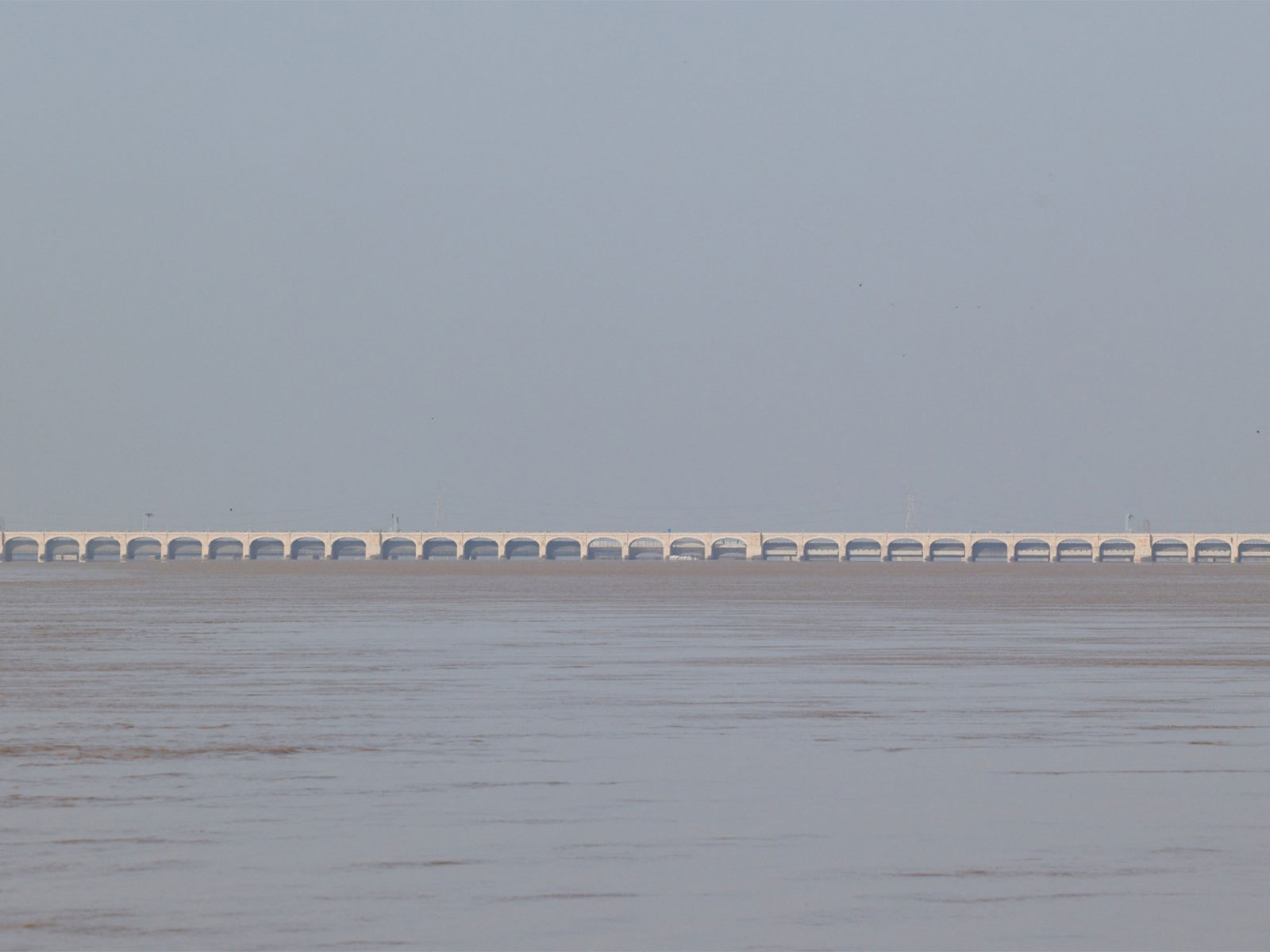 Flood water passes through a barrage in Pakistan (File Photo/Reuters)