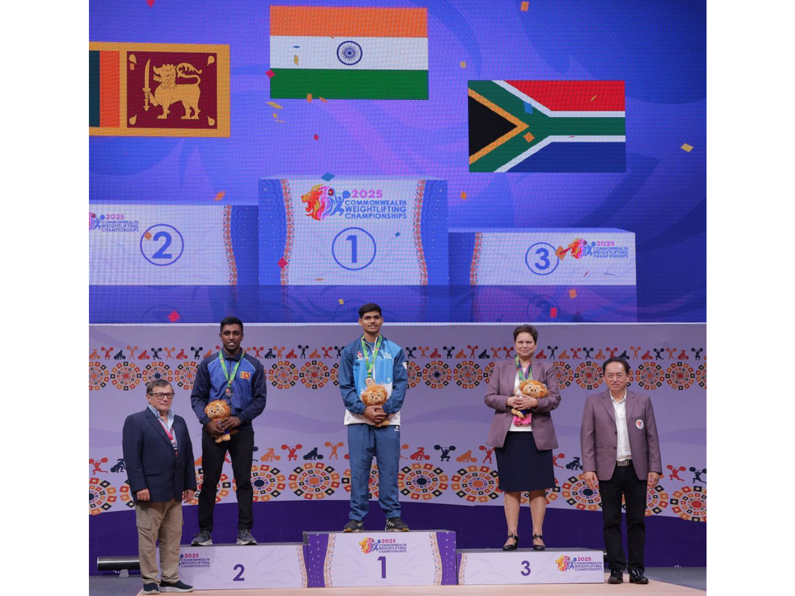 Rishikanta Singh (middle) after clinching Gold at Commonwealth Weightlifting Championship 2025 in Ahmedabad (Photo: X/@Media_SAI)