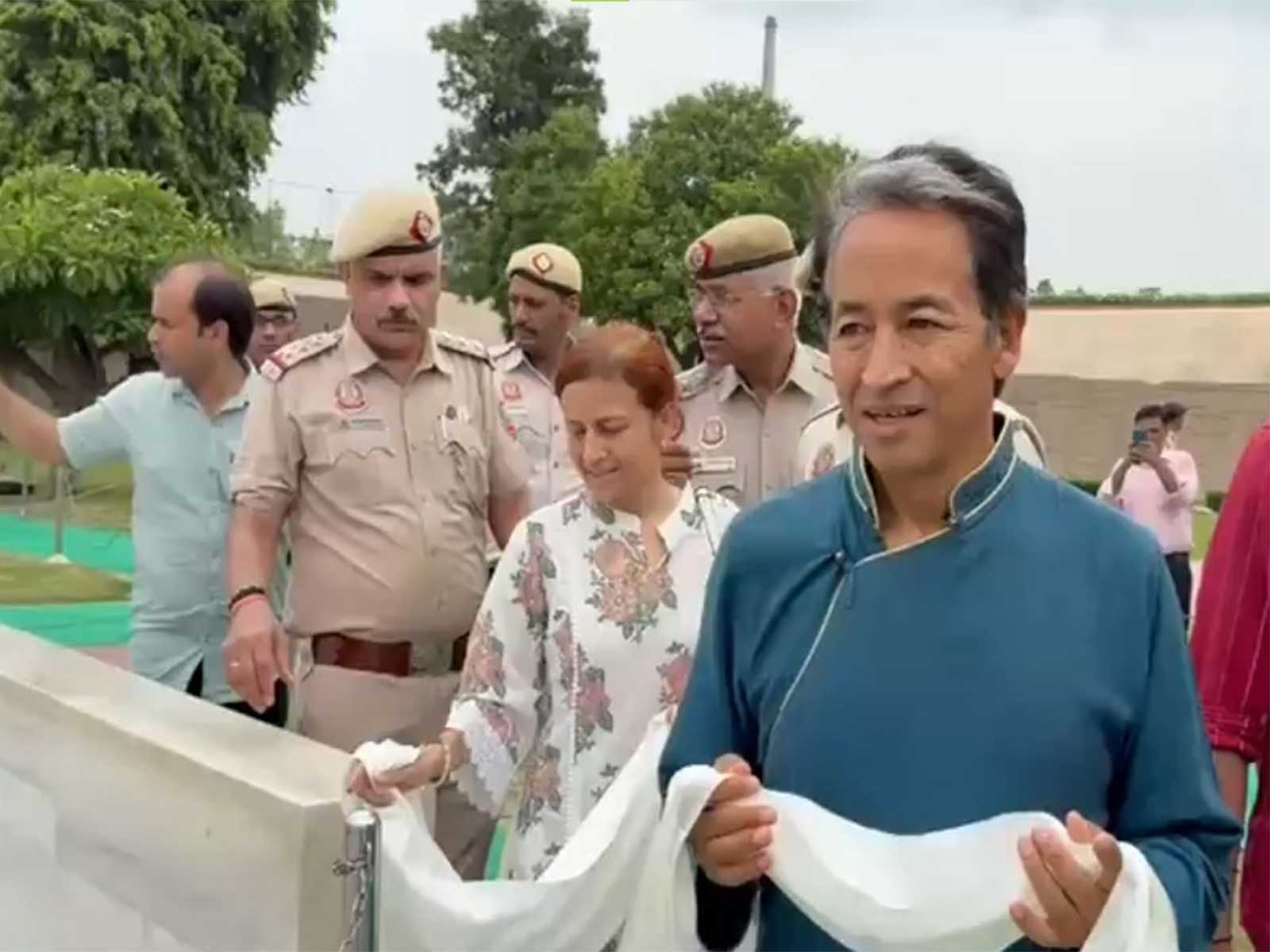 Activist Sonam Wangchuk, along with his wife Gitanjali Angmo, offers tributes at Rajghat (Photo/ANI)