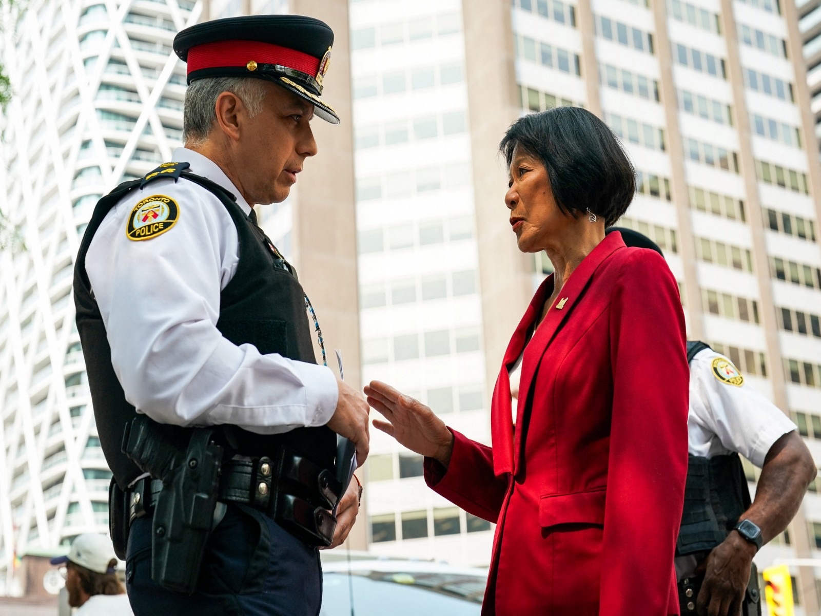 Toronto Police Deputy Chief Frank Barredo speaks with Toronto Mayor Olivia Chow at scene of a shooting at the US Consulate in Toronto (Photo/Reuters)