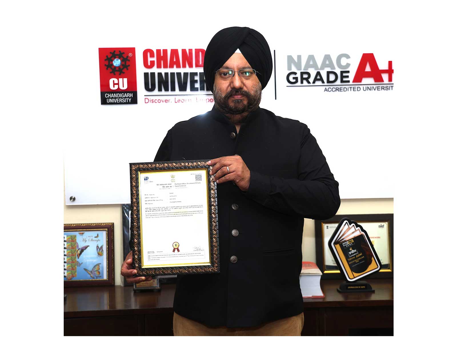Research Scholar, Prof. Dr. Satbir Singh Sehgal while holding the patent certificate 'Improved Oral Drug Absorption Study Cell' granted by the Indian Patent Office