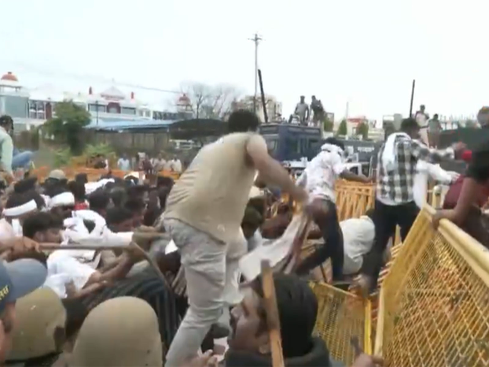 Protestors crossing the barricades (Photo/ANI)