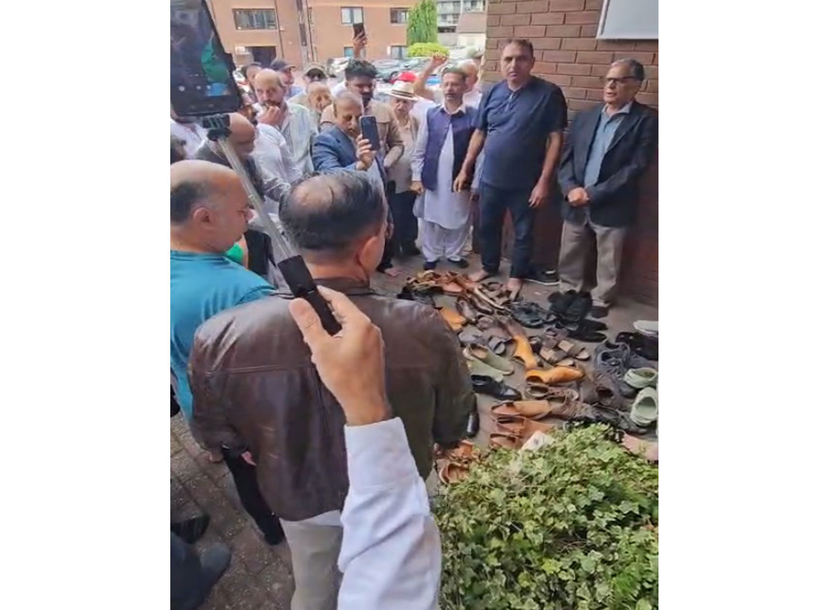 Shoes removed in protest: British Kashmiris stage protest in Birmingham against PoJK Violence (Photo/Special Arrangement)