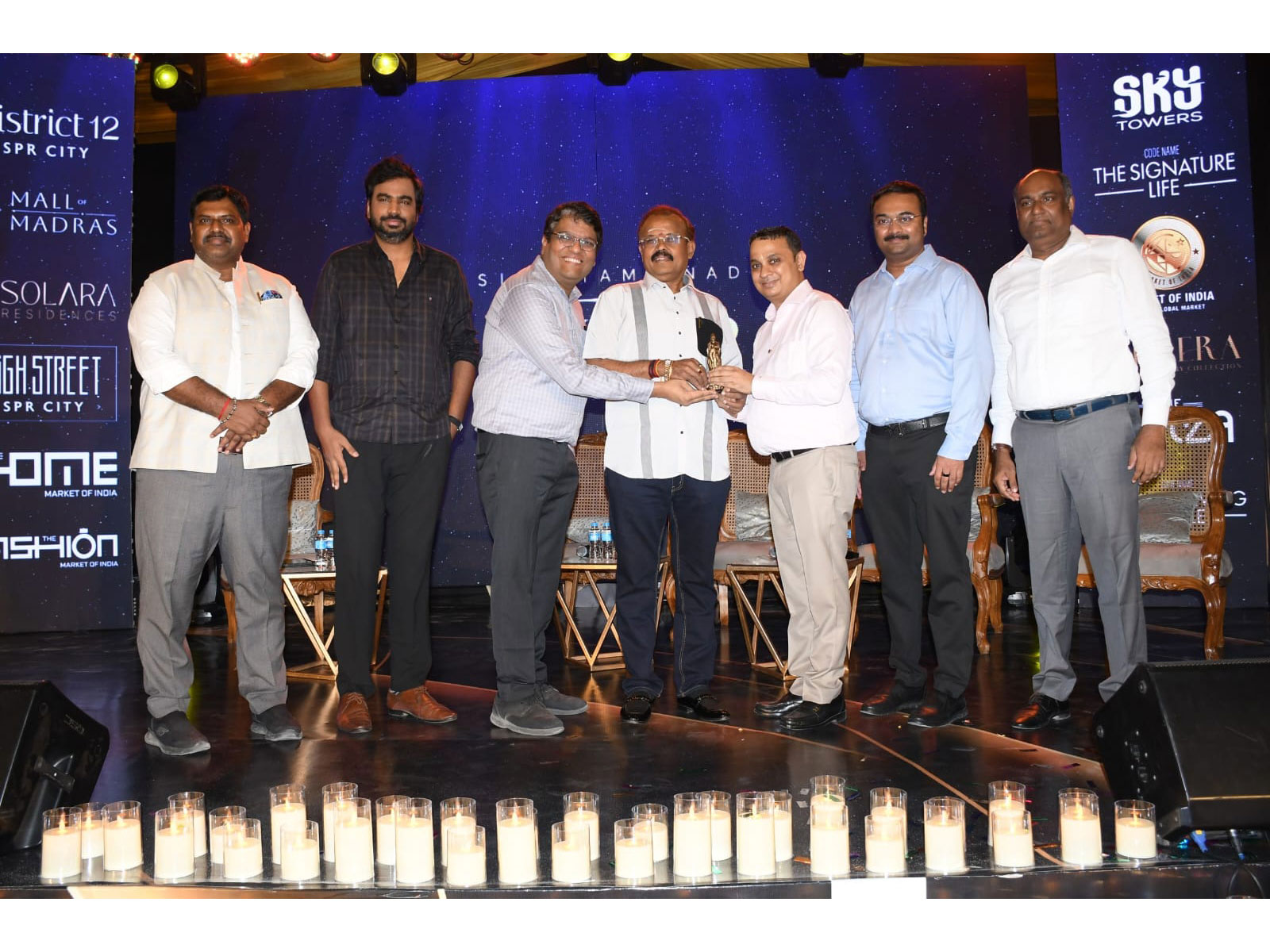 Mr. Hitesh Kawad, Managing Director and Mr. Navin Ranka, Director, felicitating Chief Guest Mr. Shelvi K. Dhamodar, Advocate, at the District 12 launch event at SPR City
