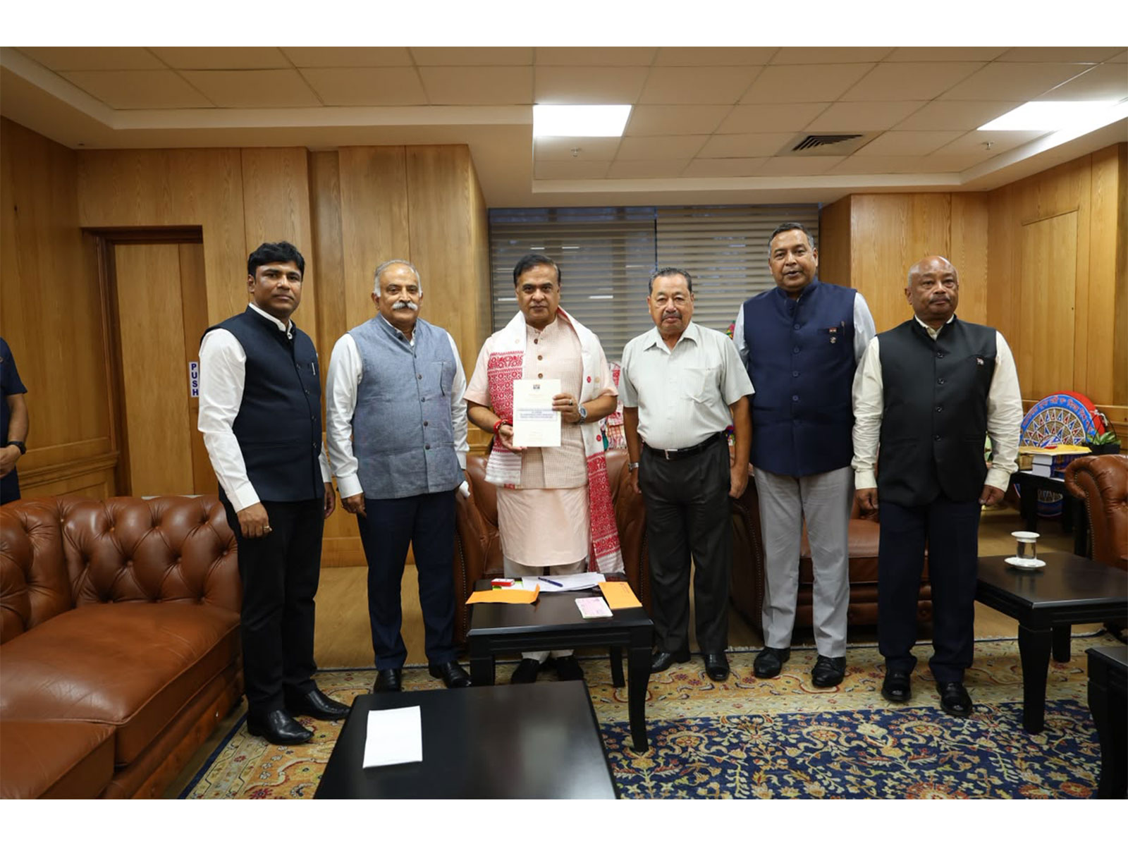 Assam ex-servicemen present ₹25 lakh cheque to Chief Minister's Relief Fund (Photo/ANI)