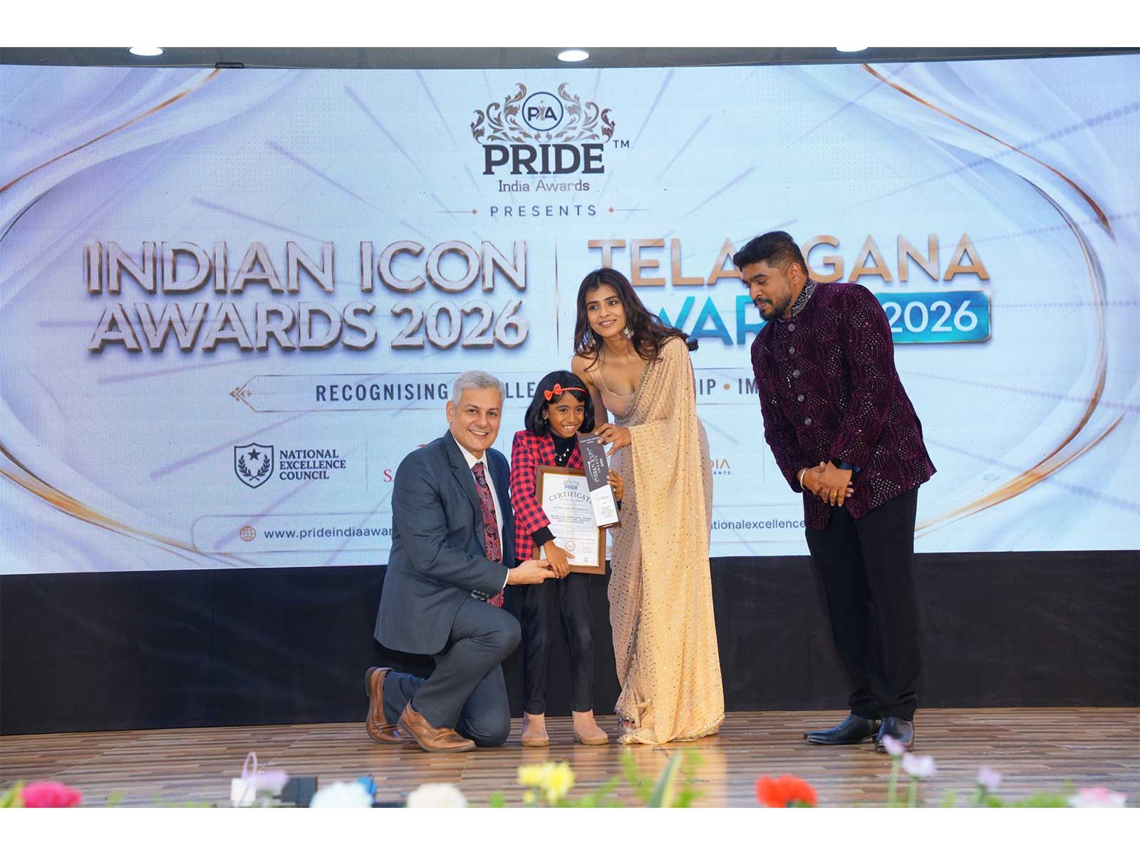 Victoria Isaac receives the Indian Icon Award 2026 for Young Prodigy of the Year, Music and Creative Innovation, at the Institution of Engineers auditorium, Hyderabad