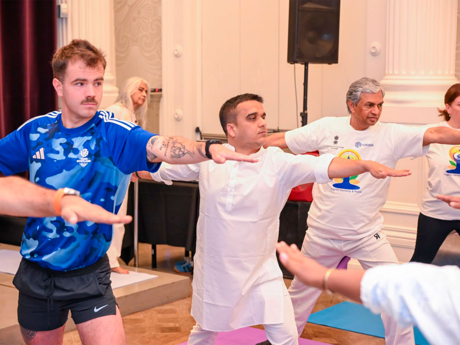 Gujarat Deputy Chief Minister Harsh Sanghavi performs Yoga session at Glasgow (Photo/Gujarat CMO)
