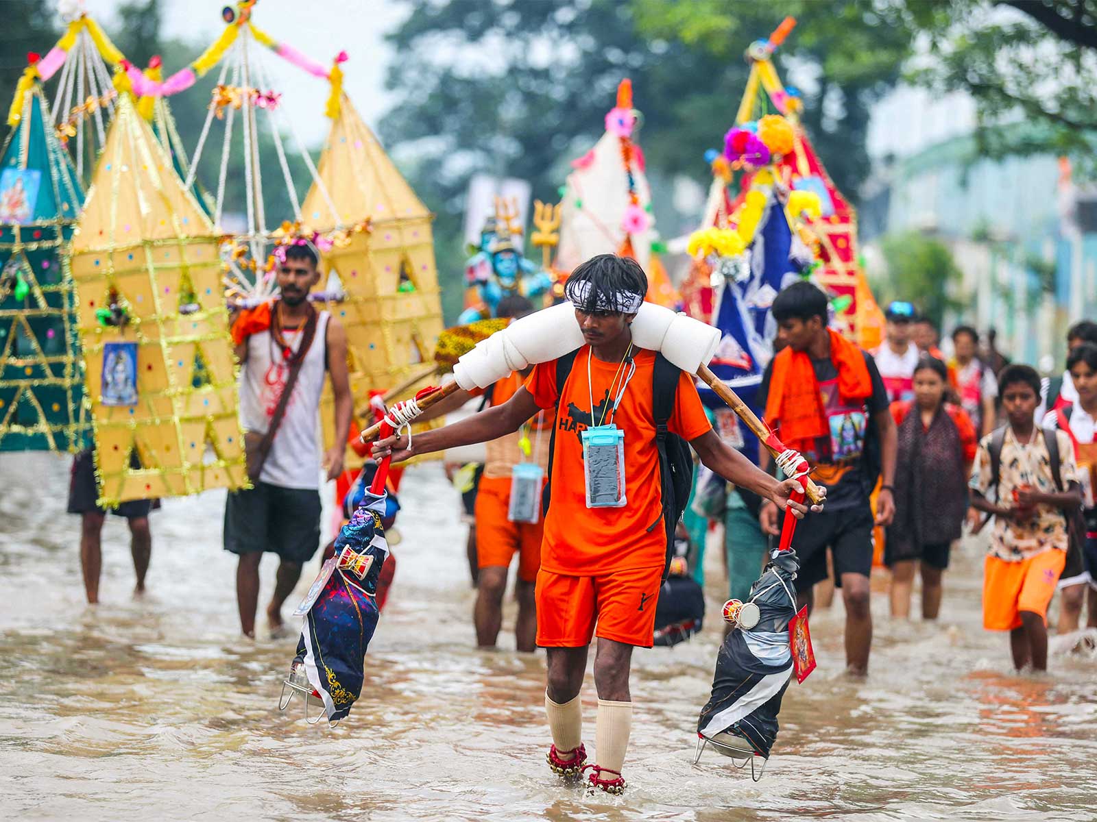 Kanwariyas carrying holy ganga water in decorated kanwars (Photo/ANI)