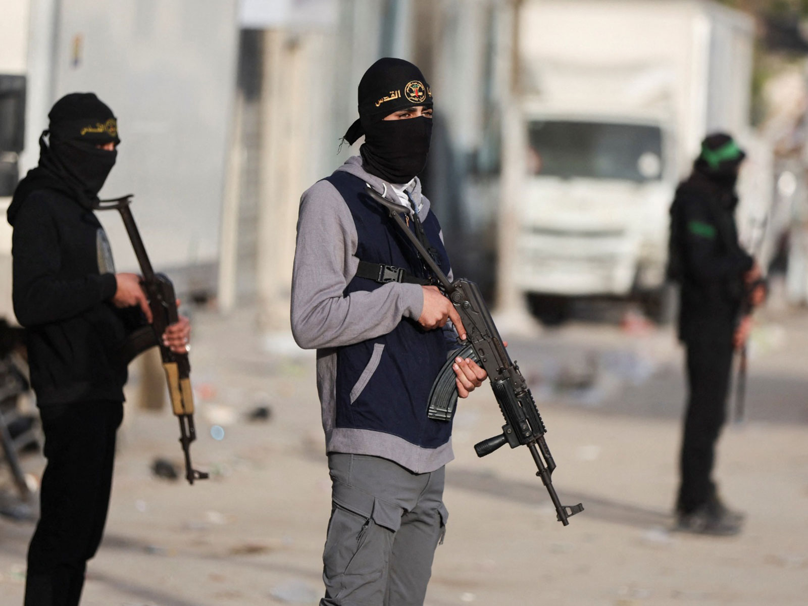 Militants from Hamas and Palestinian Islamic Jihad (PIJ) stand on a street during Eid al-Fitr in Gaza City (Photo/Reuters)