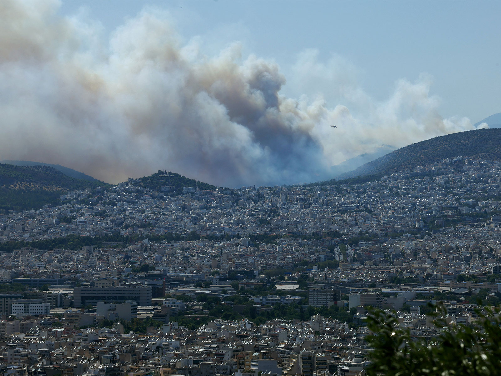 Smoke from a wildfire burning near Haidari blankets Athens (Photo/Reuters)