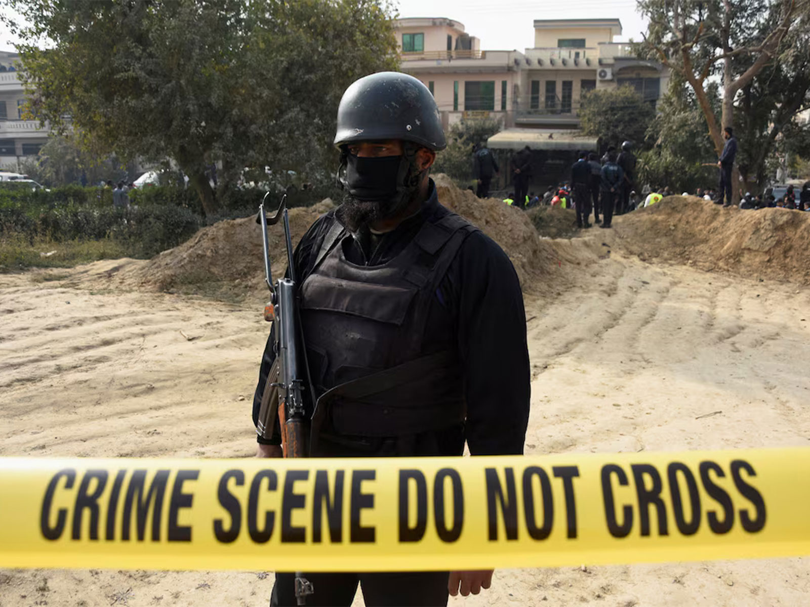 A police officer stands guard inside a cordoned-off area following a suicide car bombing in Pakistan's capital city of Islamabad. (Photo/Reuters)