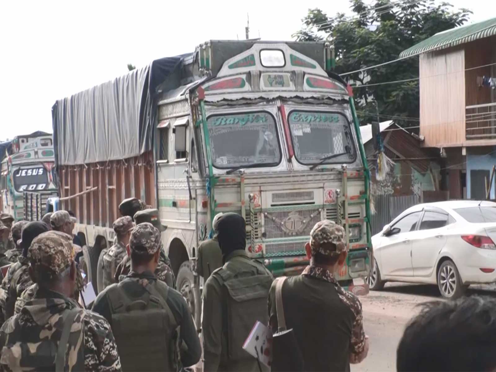 Empty goods trucks with heavy CRPF security in Manipur (Photo/ANI)