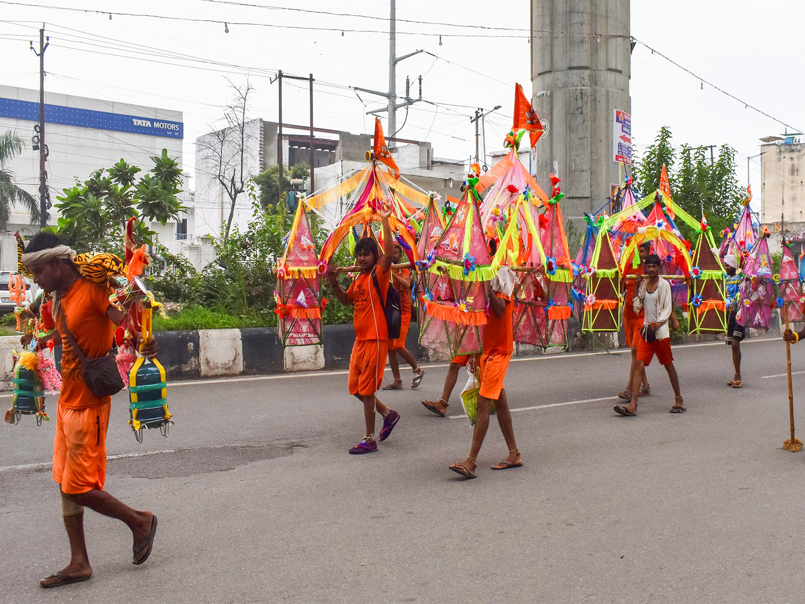 Devotees carry Ganga water in decorated kanwars during the ongoing Kanwar Yatra (Photo/ANI)