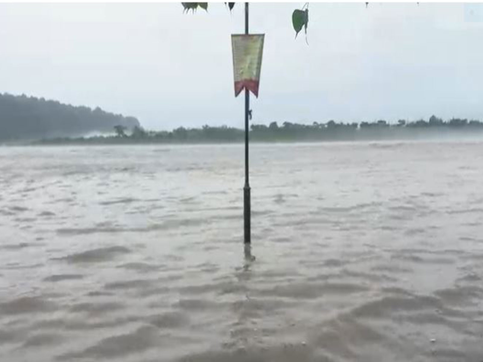 Ganga flowing above the warning level at Triveni Ghat (Photo\ANI)