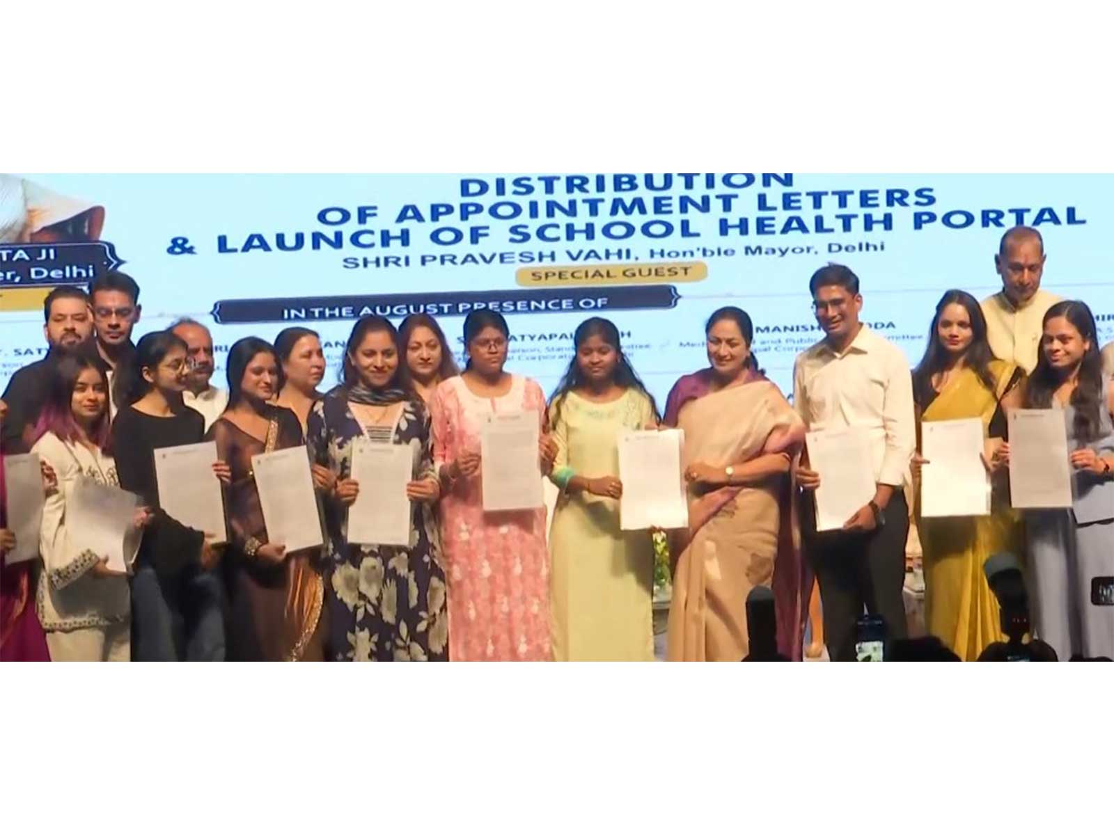 Delhi CM Rekha Gupta with recipients of appointment letters (Photo/ANI)