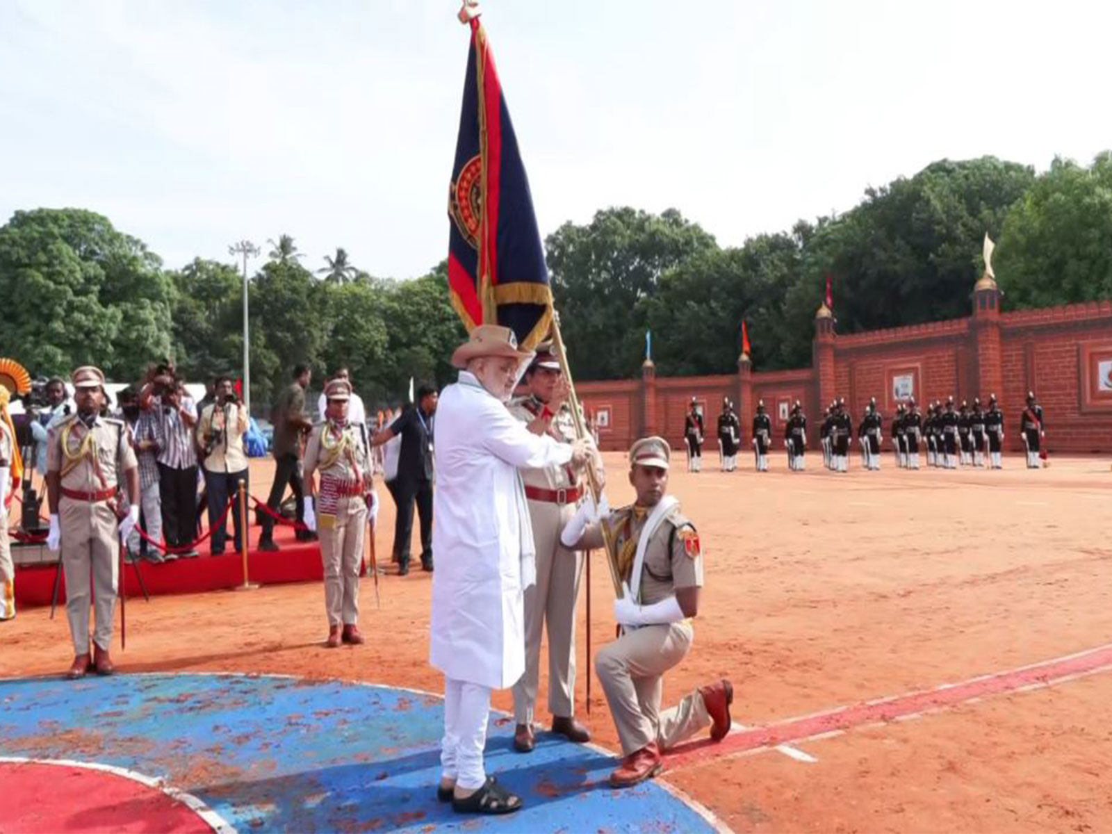 Union Home Minister Amit Shah hands over ceremonial President's Colour flag during the presentation ceremony in Puducherry (Photo/ANI)