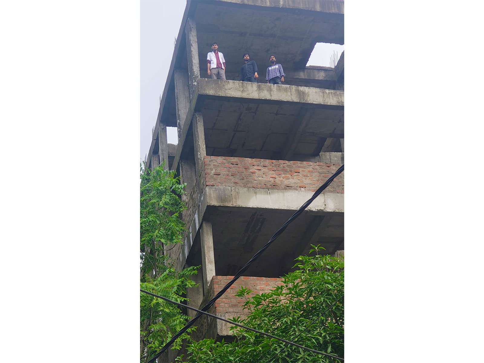 Nursing students climbed on under construction building (photo/ANI)