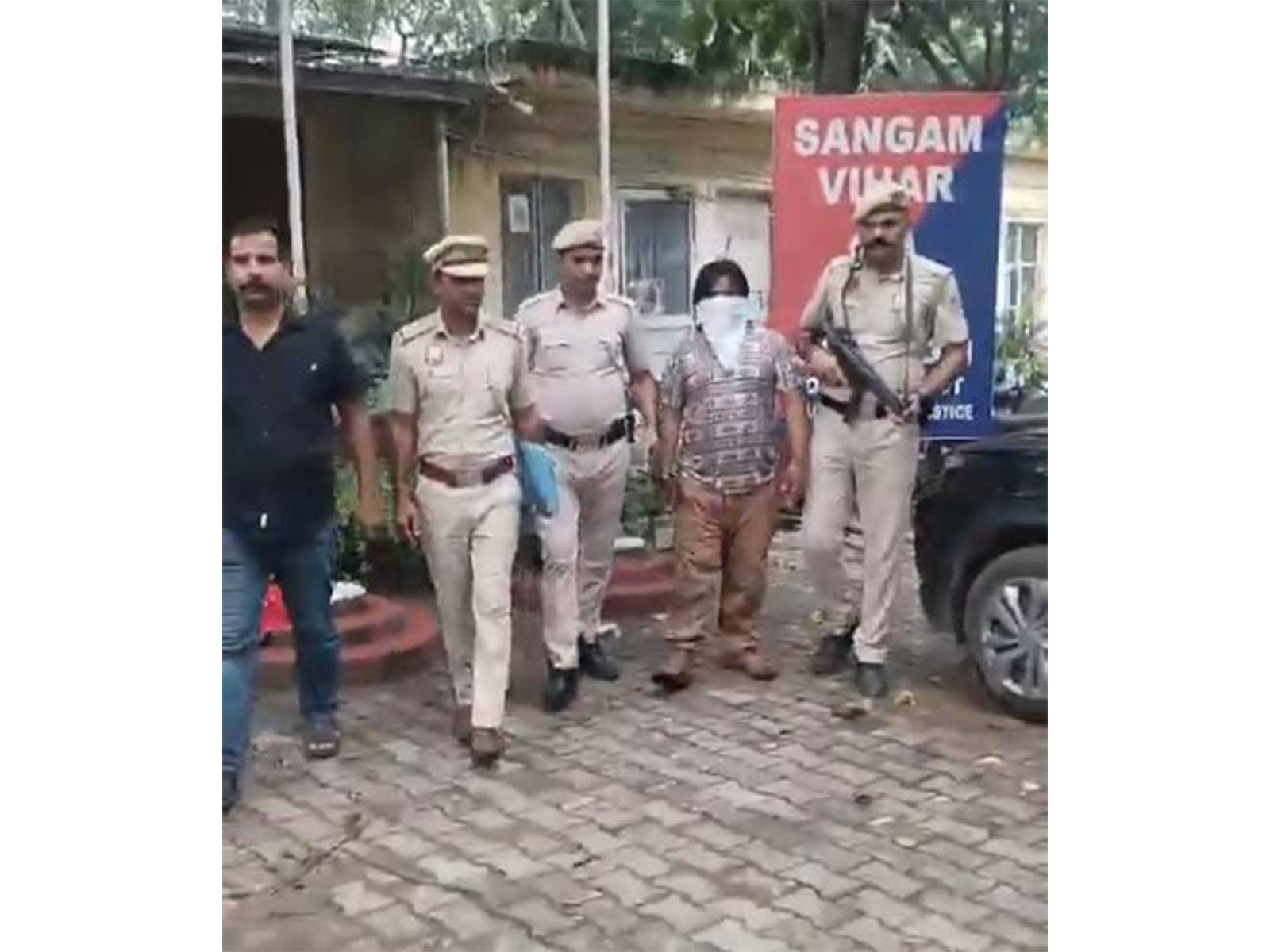 Delhi police personnel with the accused (Photo/ANI)