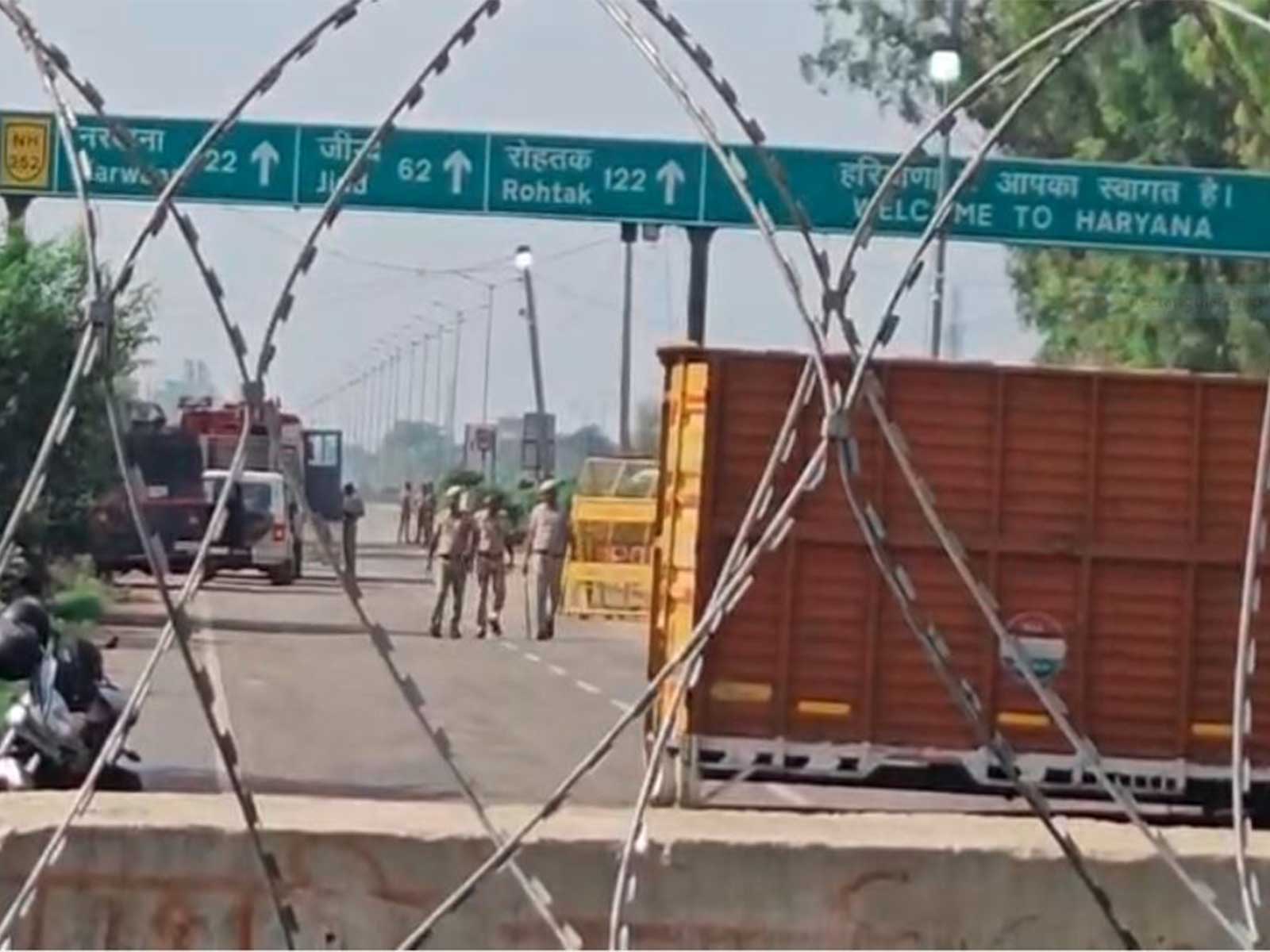 Haryana Police blocks the road leading towards Delhi at the Khanauri border (Photo/ANI)