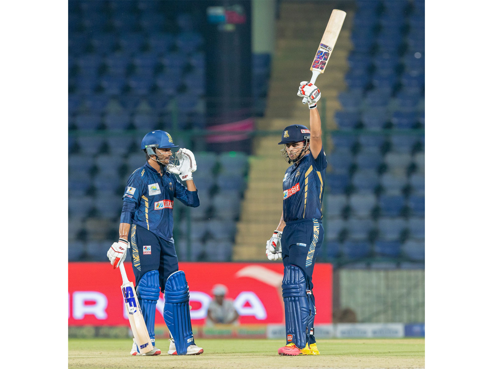 Yajas Sharma (right) raising his bat. (Photo: DPL)