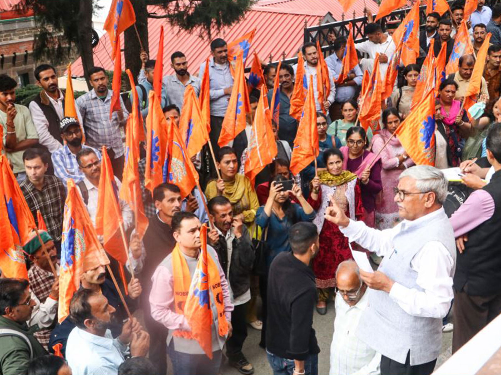 Members of Bharatiya Mazdoor Sangh stage a protest outside the DC office in Shimla (Photo/ANI)