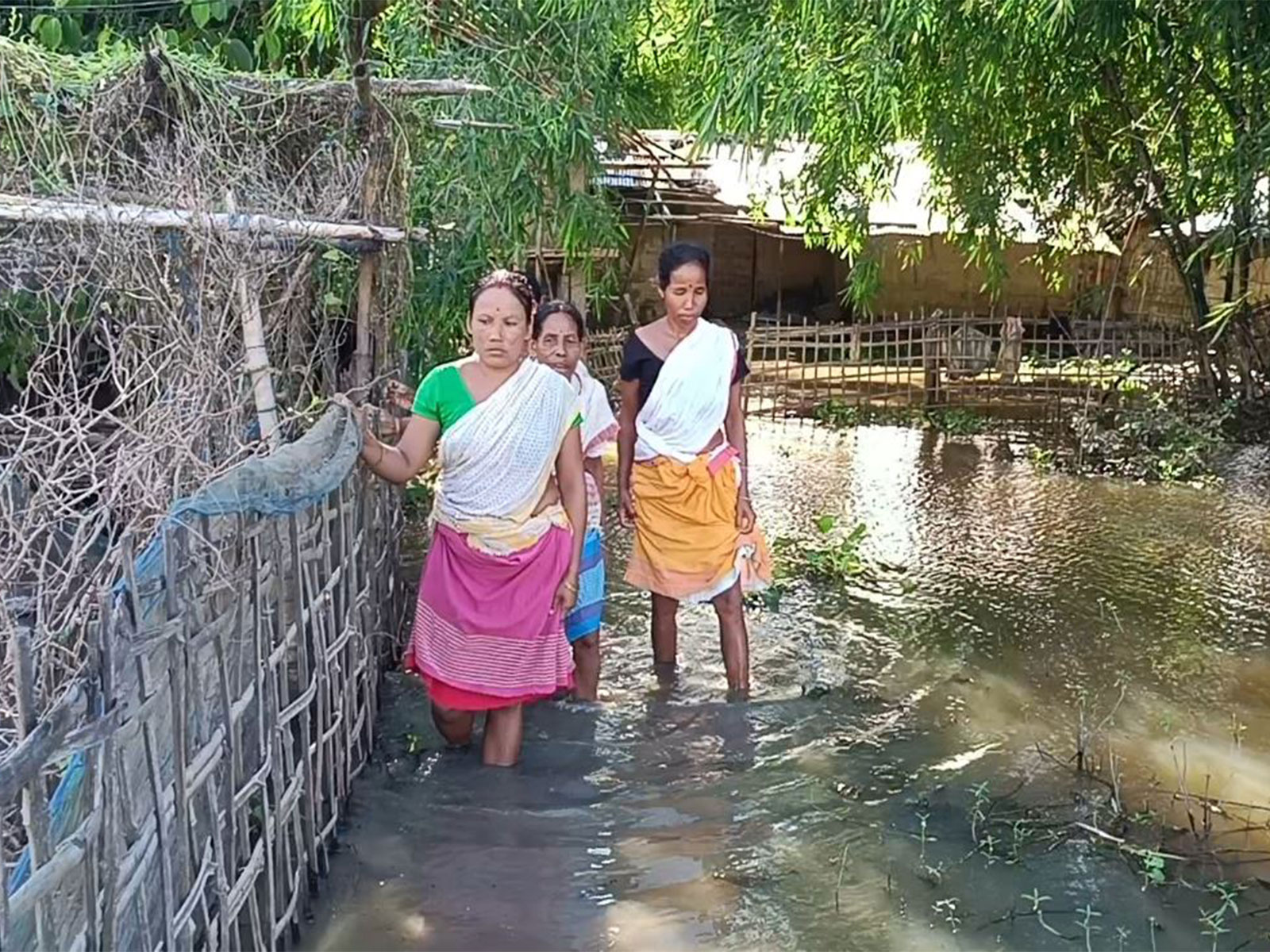 People in flood-affected area of Assam (Photo/ANI)