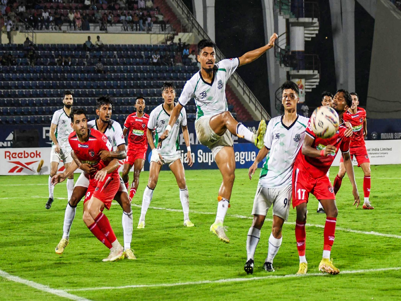 Players of North East United FC (in red) and Mohammedan SC (in white) during an ISL 2026 match (Photo: ANI)