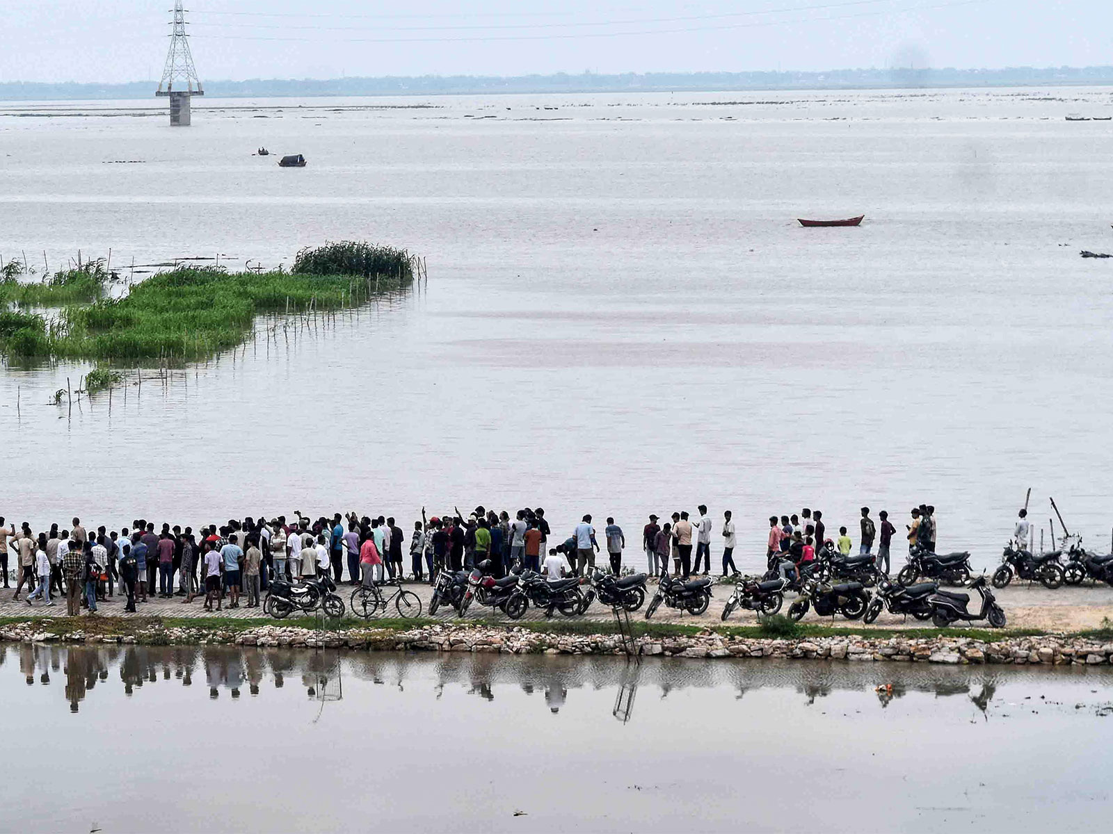 People watch as the water level of the Ganga rises  (Photo: ANI)