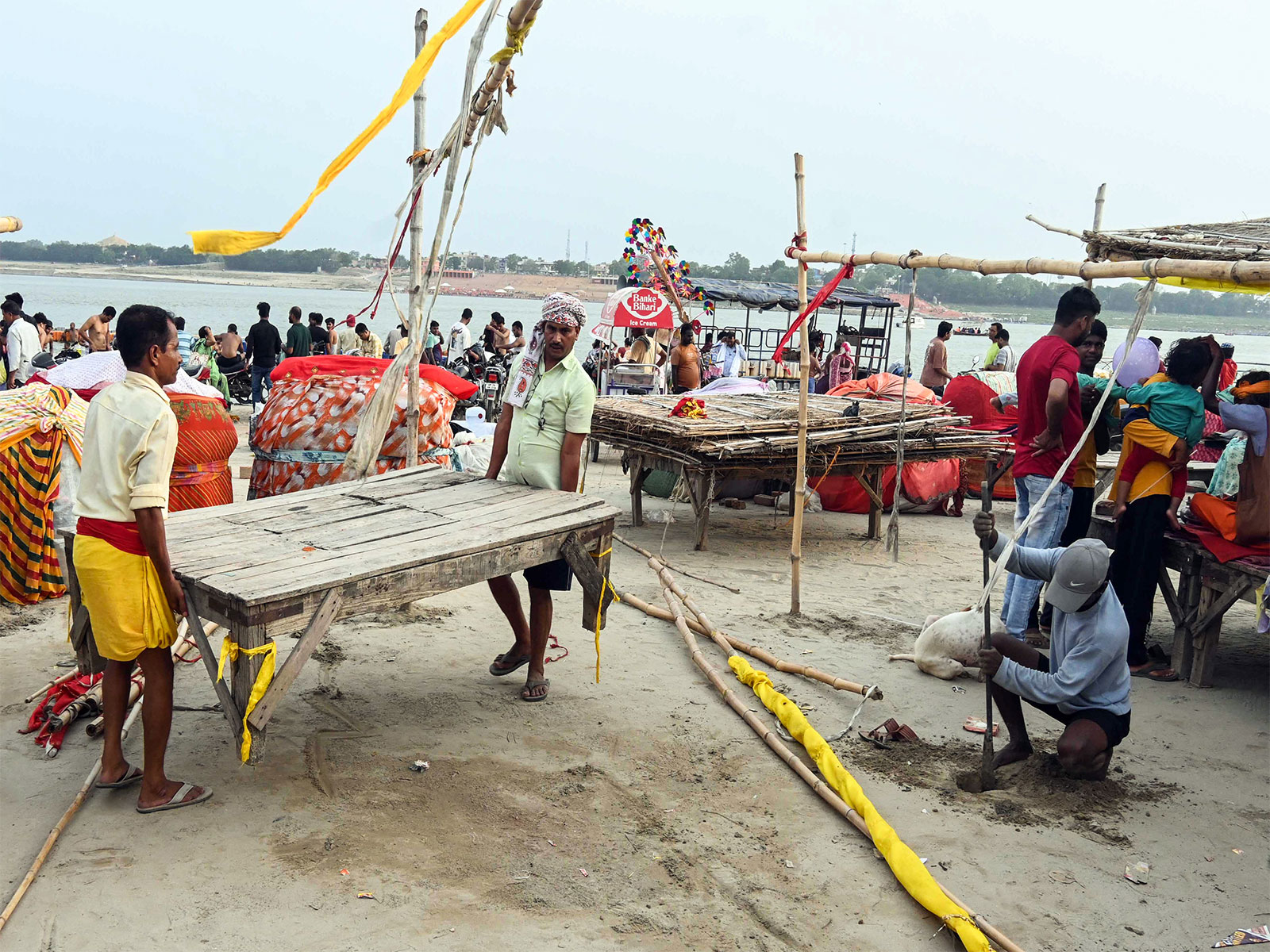 People move to safer places as monsoon rains flood Sangam area in Prayagraj (File Photo/ANI)