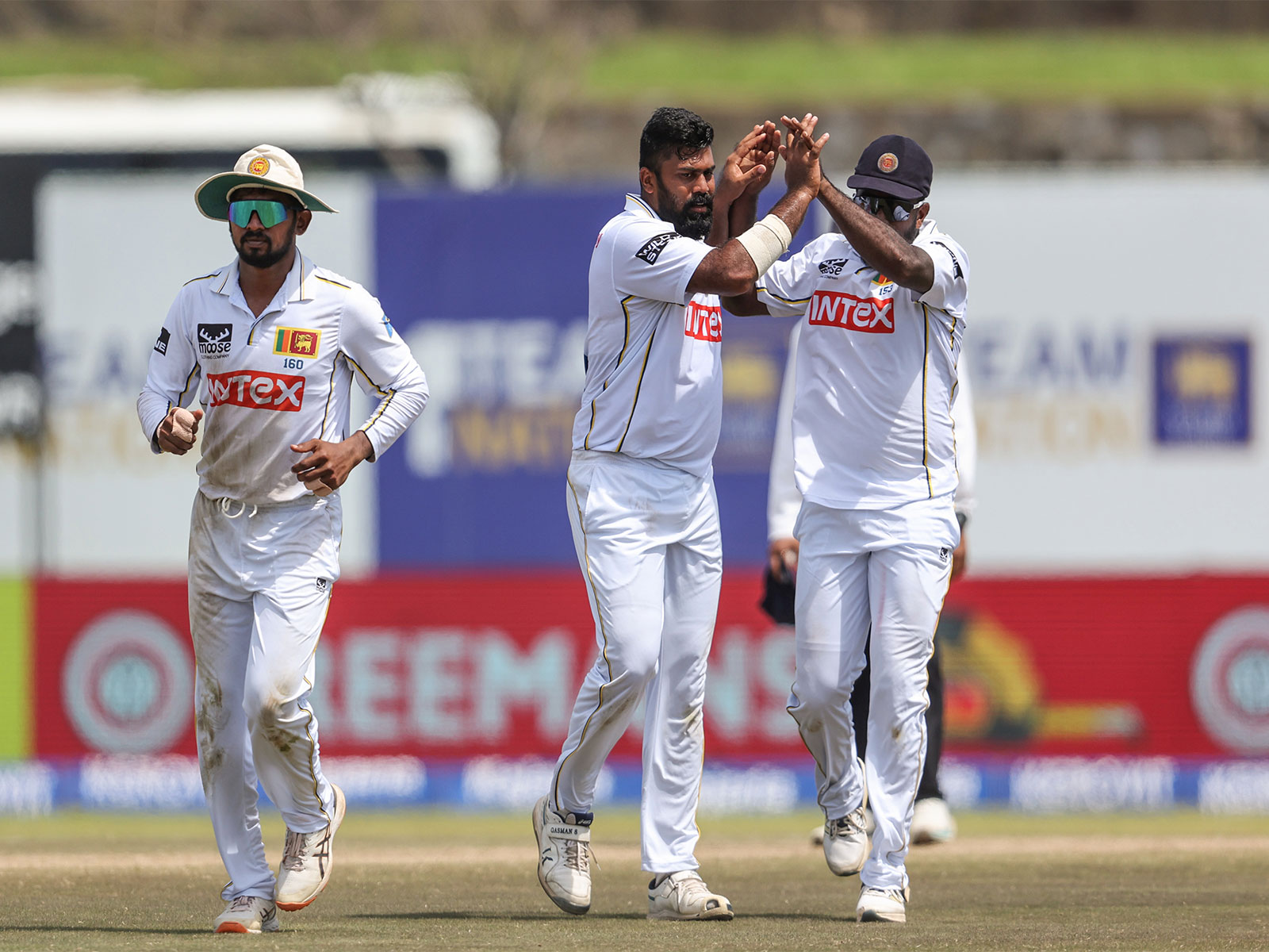 Sri Lanka cricket team players celebrating a wicket in Galle Test. (Photo: ANI)