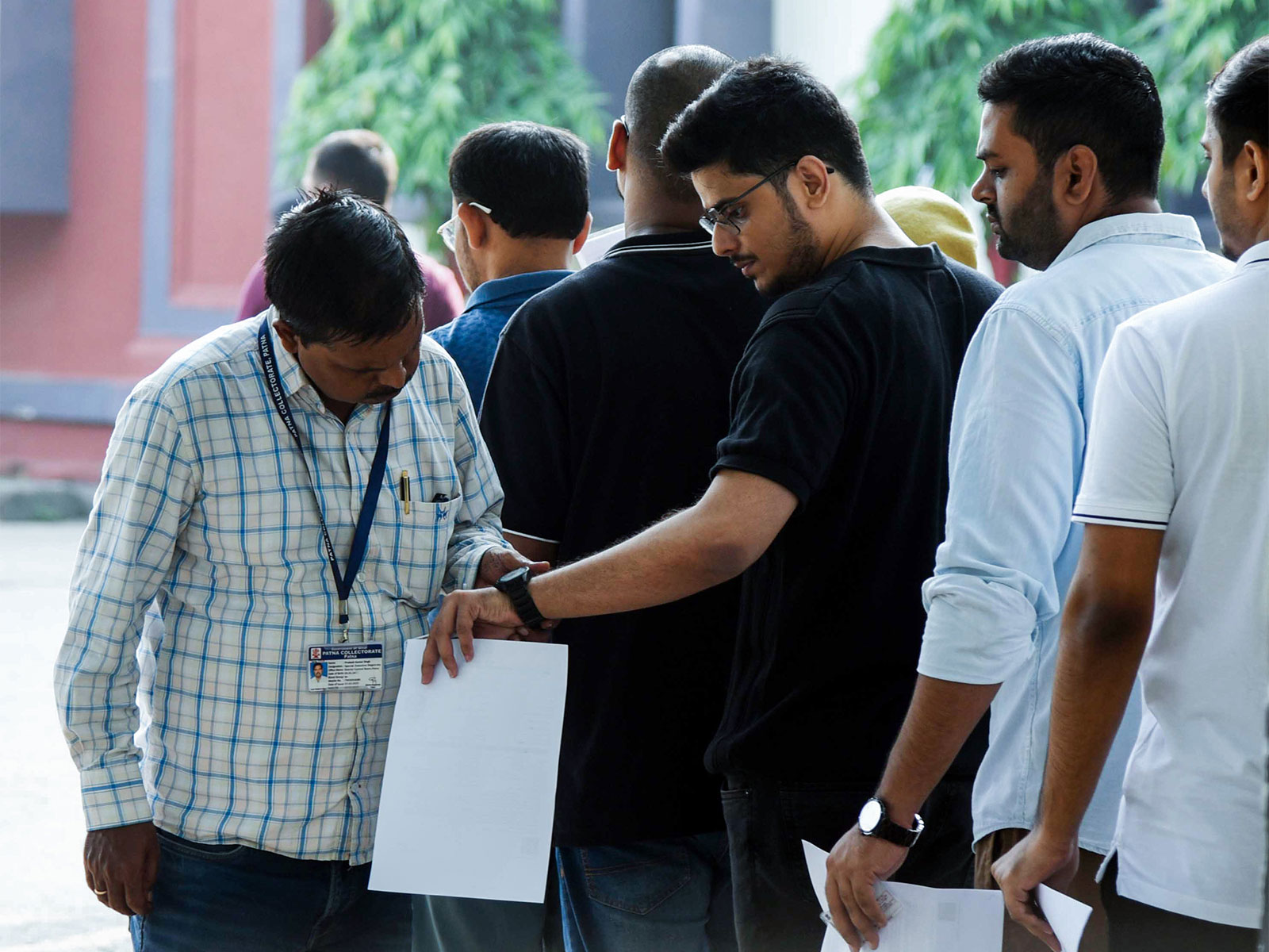 Aspirants queue up for a security check at an examination centre for the UPSC Civil Services (Main) Exam, in Patna (Photo/ANI)