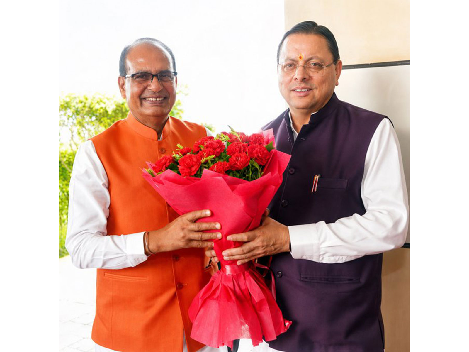 Uttarakhand Chief Minister Pushkar Singh Dhami with Union Minister Shivraj Singh Chouhan (Photo/ANI)