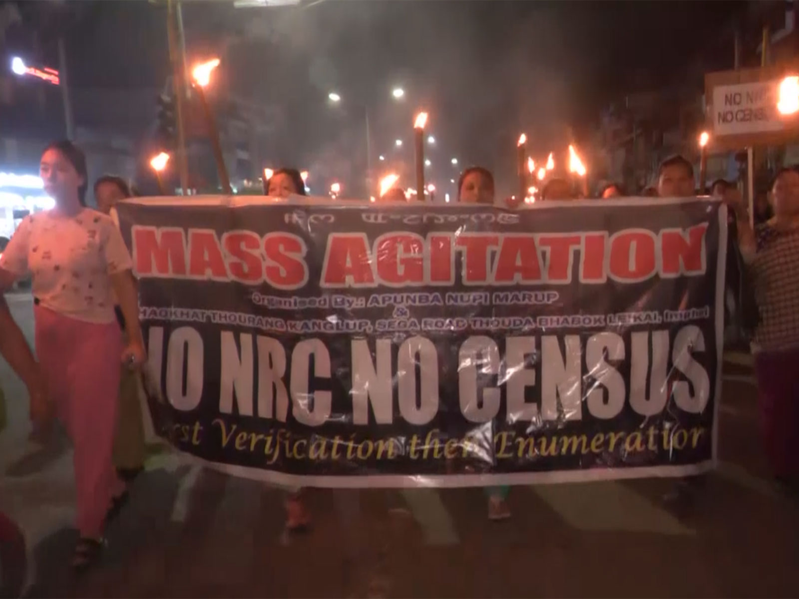 Meira Paibi activists hold massive torch rally in Imphal (Photo/ANI)