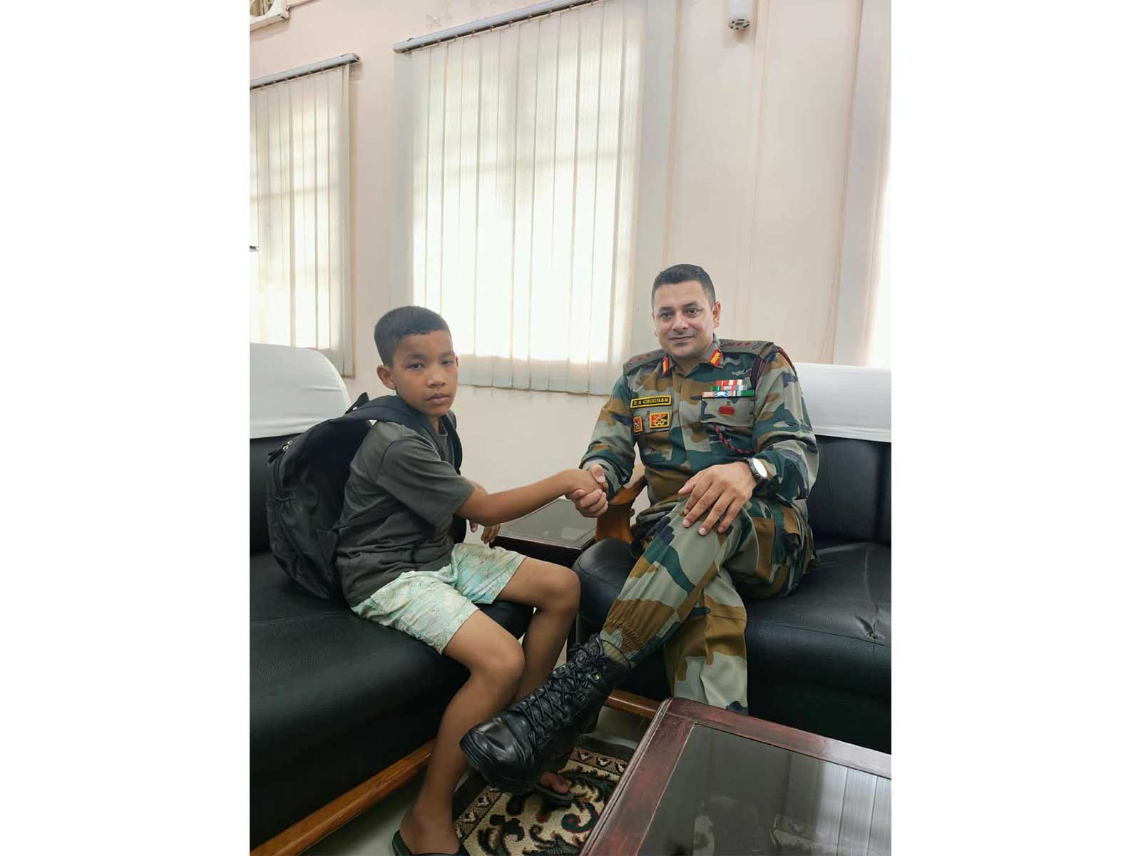 Assam Rifles personnel with the 10-year-old boy, Joseph Mao, who was rescued after going missing from Dimapur (Photo/Assam Rifles)