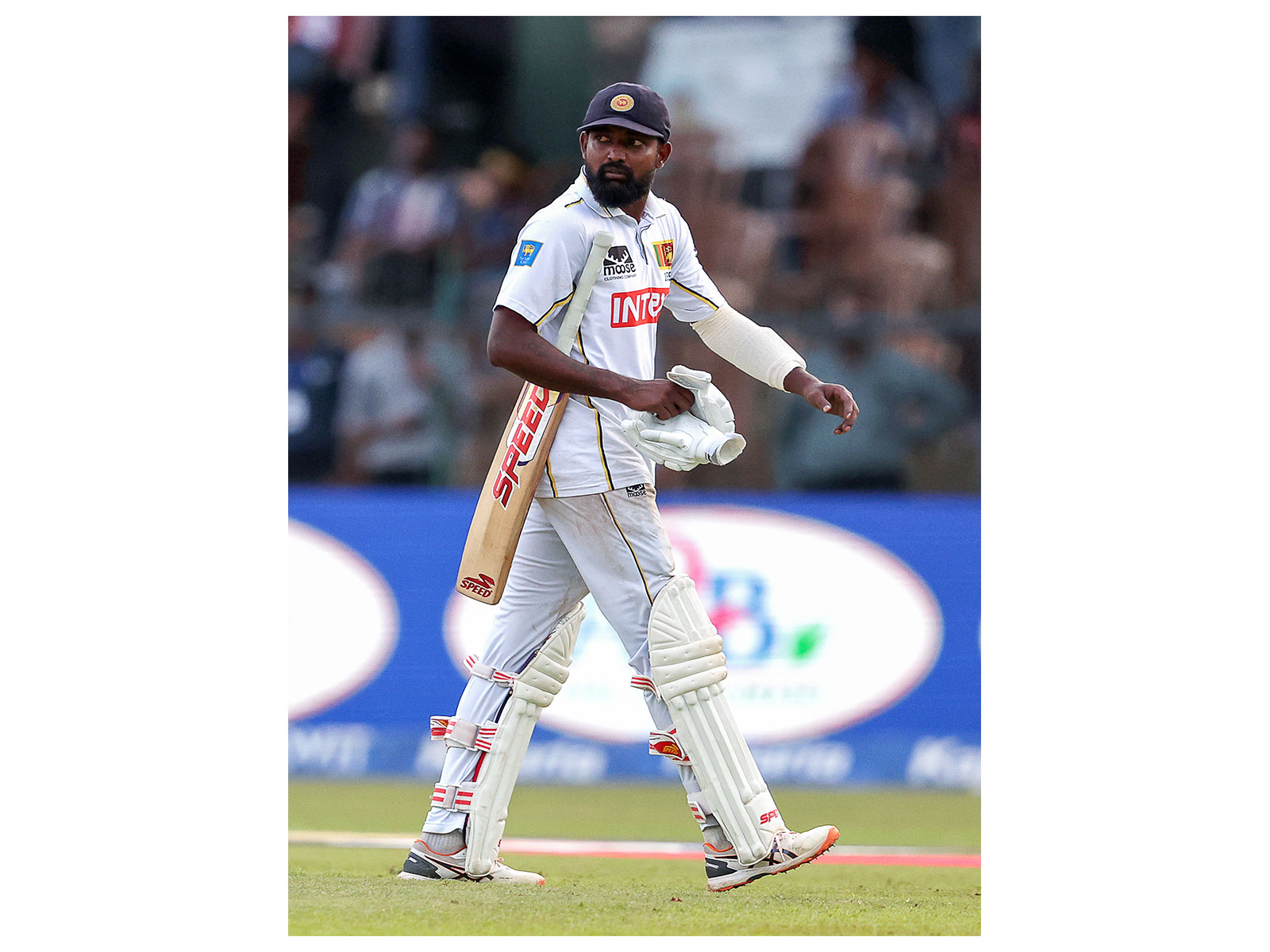 Prabath Jayasuriya walking back to the pavillion after losing his wicket. (Photo: ANI)