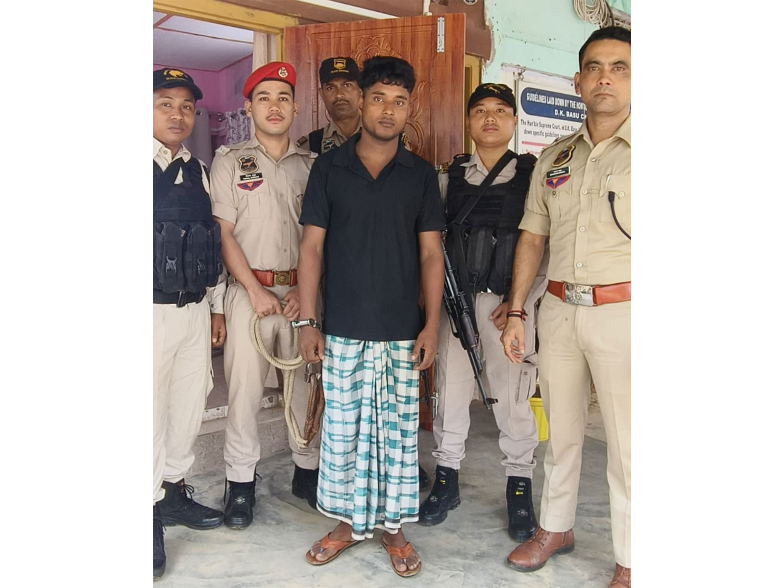 Assam STF personnel with the alleged SBN operative (Photo/ANI)
