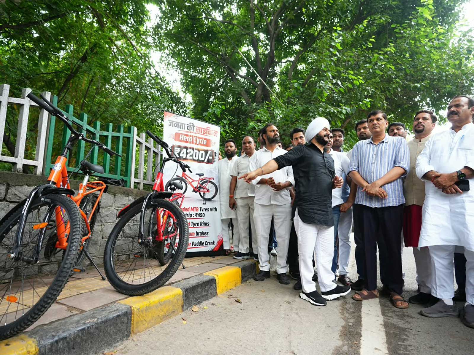 AAP leaders and MLAs, led by Saurabh Bharadwaj, place bicycles outside the LG's office during a protest against alleged scams and demand the resignation of Minister Ashish Sood.  (Photo/ANI)