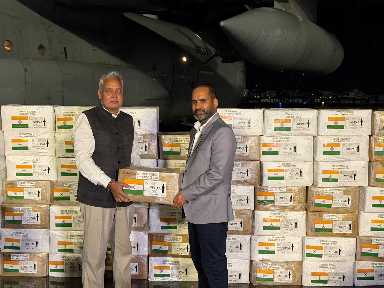 Indian Ambassador to Nepal Naveen Srivastava handing over humanitarian aid materials from India to Nepal's Minister for Culture, Tourism and Civil Aviation, Khadka Raj Poudel. (Photo: X/@MEAIndia)