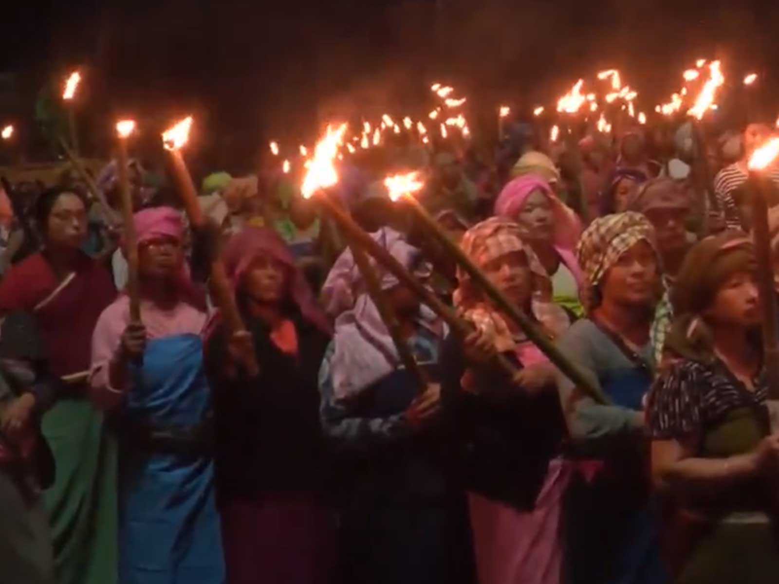 Meira Paibi activists hold massive torch rally in Imphal (Photo/ANI)