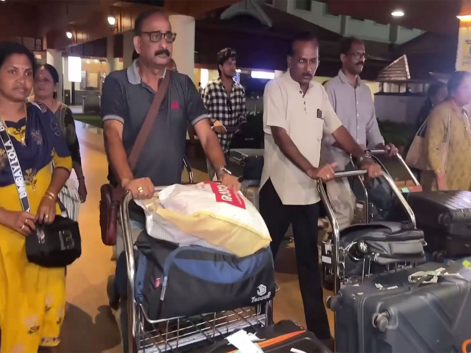 A 36-member group of Malayalis who were caught in a flash flood in Nepal narrowly escaped the disaster and returned to Nedumbassery on Sunday (Photo:ANI).