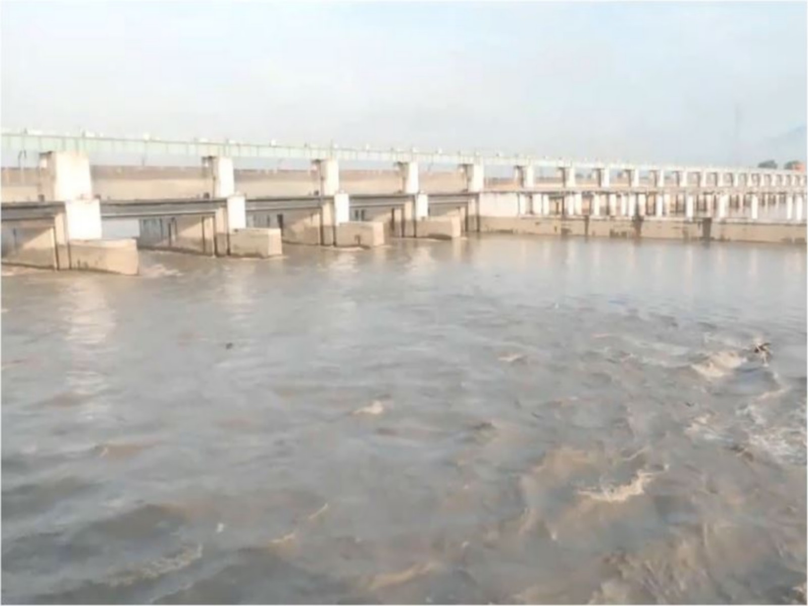 Visuals of the Gandak River at the Valmikinagar Barrage where the water level currently stands at 1,14,000 cusecs (Photo/ANI)
