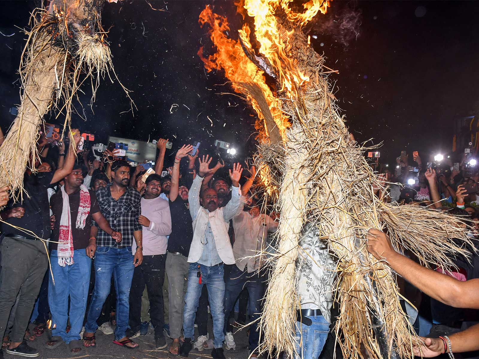 Students burn effigies during a protest against alleged irregularities in recruitment examinations (File Photo/ANI)