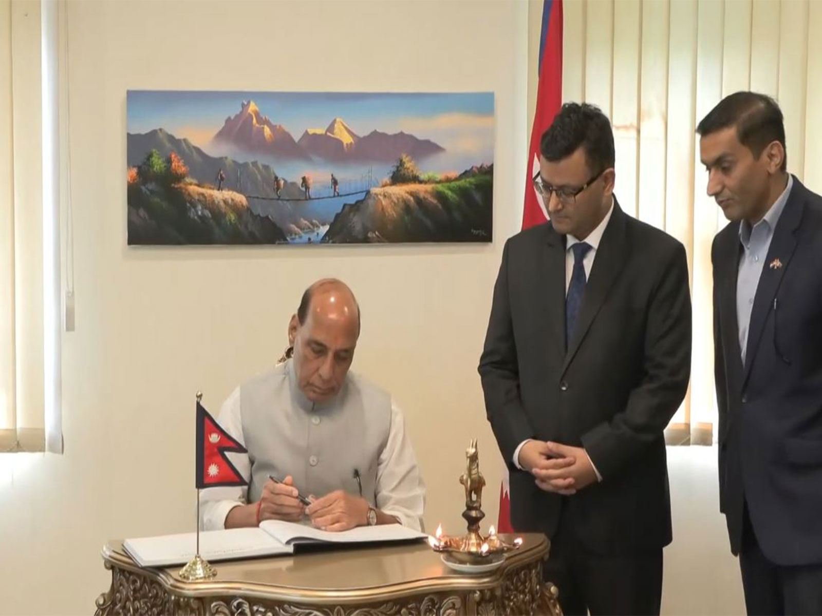 Defence Minister Rajnath Singh signs condolence book at Nepal Embassy over Nepal floods (Photo/ANI)