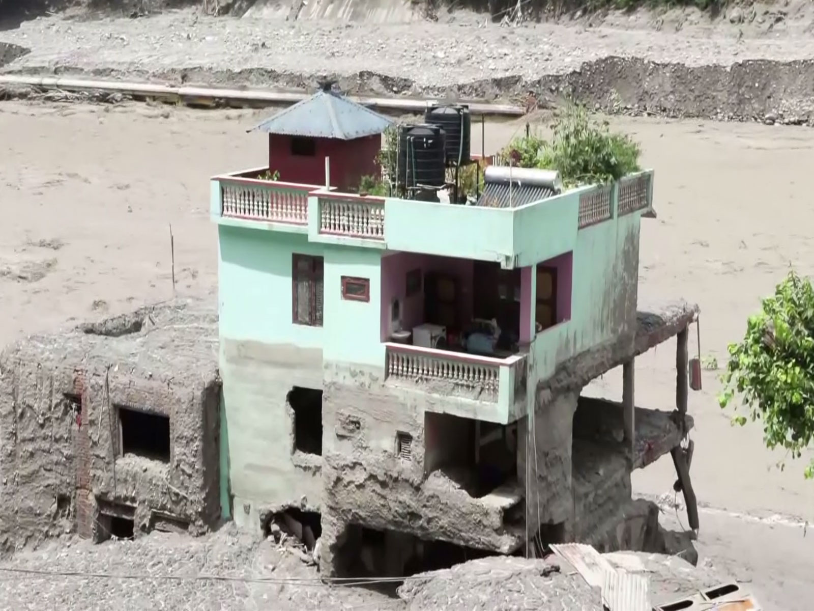 Mint green house stand firm in Trishuli amid Nepal floods (Photo/ANI)