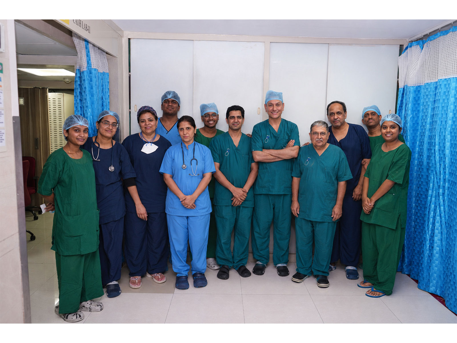Centre L-R: Dr Malav Jhala, Dr Dhiraj Gupta, Dr Darshan Jhala & Dr Nitin Gokhale with cathlab and technical staff after India's first combined PFA and LAAO procedure