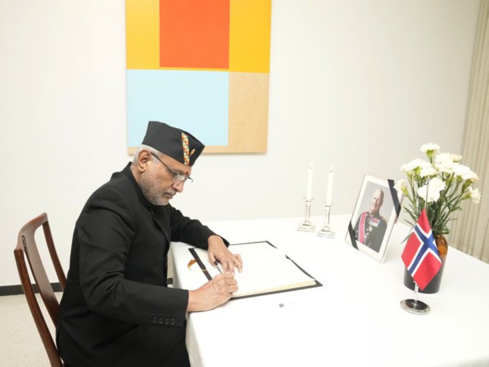 Vice President C P Radhakrishnan signing the condolence book at the Royal Norwegian Embassy in New Delhi on Tuesday, following the passing of Norway's King Harald V (Photo: X/@VPIndia)