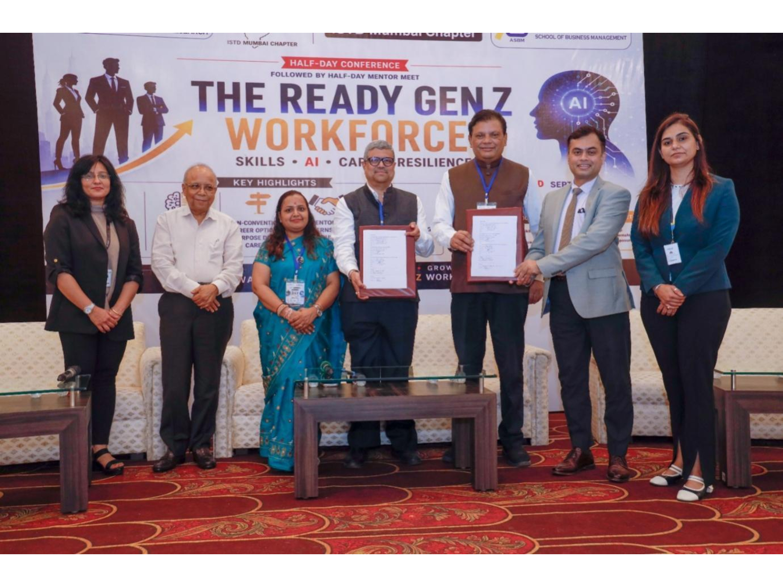 Signing the MOU between AIMTR-ASBM and ISTD. From left to right: Prof. Neha Bhatia, Dr. Rajan Saxena, Dr. Kavita Pandey, Shri Uday Ghag, Dr. Balkrishna Parab, Dr. Suvrashish Sarkar, and Dr. Vrittee Parekh.
